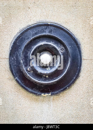 An old fashioned door bell on a building in Cambridge UK Stock Photo