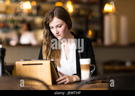 business woman working and surfing the internet at cafe at break Stock Photo