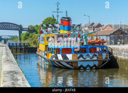 View of the pleasure cruiser 'Snowdrop' on the Manchester Ship Canal awaiting transit through the locks system at Latchford Locks in Warrington. Stock Photo