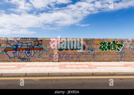 Graffiti painted with name ENOK on wall in Playa San Juan, Tenerife, Canary Islands, Spain Stock Photo
