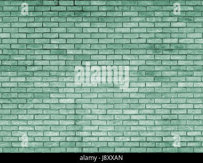 green toned brick wall with repeating pattern Stock Photo