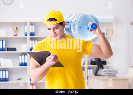 Man delivering water bottle to the office Stock Photo