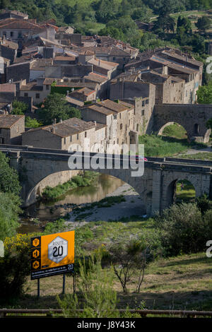 Aerial landscape overlooking the pretty French medieval walled village of Lagrasse (incl the Church of Saint-Michel) on the River Orbieu, on 23rd May, 2017, in Lagrasse, Languedoc-Rousillon, south of France. Lagrasse is listed as one of France's most beautiful villages and lies on the famous Route 20 wine route in the Basses-Corbieres region dating to the 13th century. Stock Photo