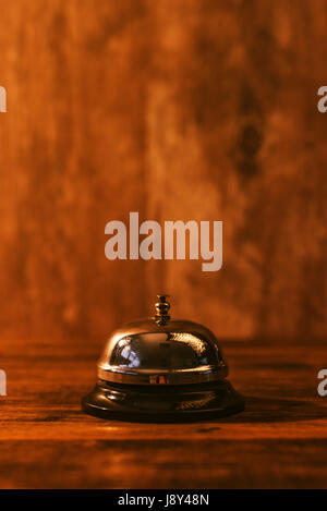 Hotel reception bell, service bell on the table, selective focus Stock Photo