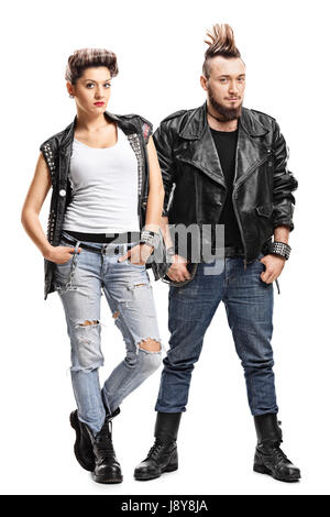 Full length portrait of a female and a male punker looking at the camera isolated on white background Stock Photo