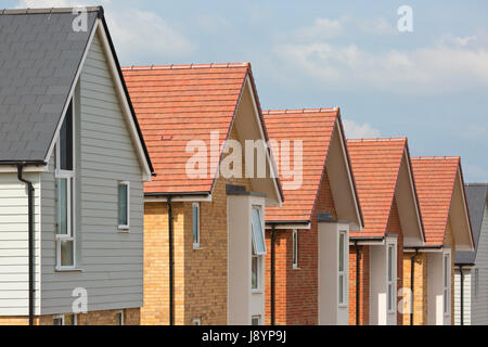 Roofs of new houses in a row with blue sky Stock Photo