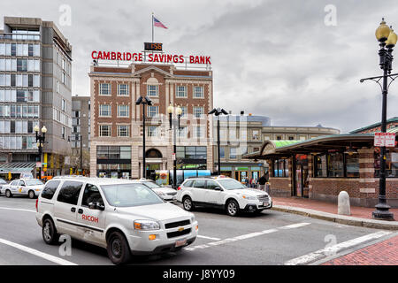 Cambridge, USA - April 29, 2015: Road with car traffic at Cambridge, Massachusetts, USA. Cambridge Savings Bank on the background Stock Photo