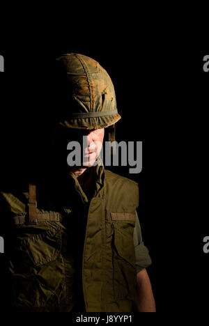 US Marine from the Vietnam War period against a black background. Stock Photo