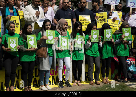 Solidarity gathering in remembrance of the Manchester attack victims in Altab Ali Park on May 26th 2017 in Whitechapel in East London, United Kingdom. People of all faiths but mainly Muslims from the local communities as well as other ethnicities came together in a multicultural gathering to stand together against terrorism and to think of the families affected by the recent events. Stock Photo