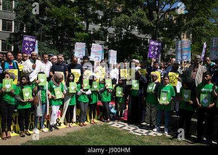 Solidarity gathering in remembrance of the Manchester attack victims in Altab Ali Park on May 26th 2017 in Whitechapel in East London, United Kingdom. People of all faiths but mainly Muslims from the local communities as well as other ethnicities came together in a multicultural gathering to stand together against terrorism and to think of the families affected by the recent events. Stock Photo