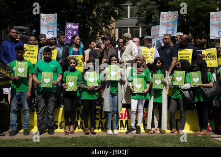 Solidarity gathering in remembrance of the Manchester attack victims in Altab Ali Park on May 26th 2017 in Whitechapel in East London, United Kingdom. People of all faiths but mainly Muslims from the local communities as well as other ethnicities came together in a multicultural gathering to stand together against terrorism and to think of the families affected by the recent events. Stock Photo