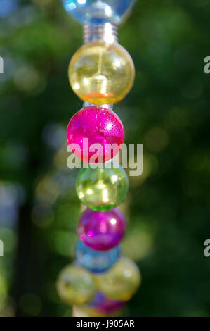 Colorful vitreous bulbs. Lamps on wire. Stock Photo