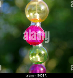 Colorful vitreous bulbs. Lamps on wire. Stock Photo