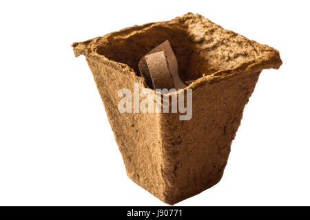 Peat pot for planting plants on white background Stock Photo