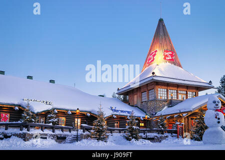 Rovaniemi, Finland - March 5, 2017: Santa Claus Office and Snowman at Santa Village with Christmas trees, Lapland, Finland, on Arctic Circle in winter Stock Photo