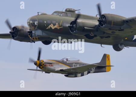 B-17 Flying Fortress 'Sally B, being escorted by a North American p-51 Mustang 'Miss Velma' Stock Photo