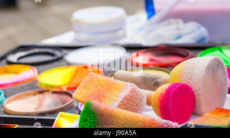 Color cosmetics, brushes and sponges for face painting. Children party Stock Photo