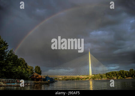 Belgrade, Serbia - Rainbow in the sky above the Ada Bridge Stock Photo