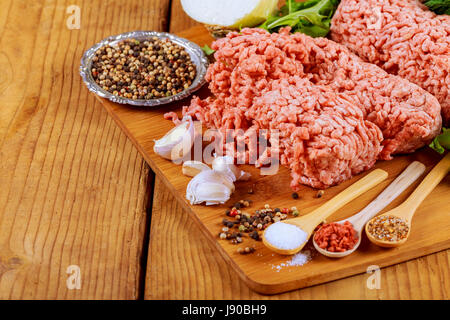 Grass Fed Organic Raw ground beef with spices Stock Photo