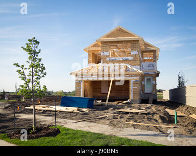 A two-storey residential house under construction in the Edmonton suburb of Beaumont, Alberta, Canada. Stock Photo