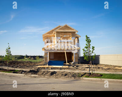 A two-storey residential house under construction in the Edmonton suburb of Beaumont, Alberta, Canada. Stock Photo