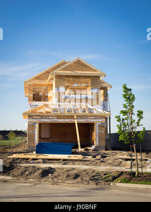 A two-storey residential house under construction in the Edmonton suburb of Beaumont, Alberta, Canada. Stock Photo