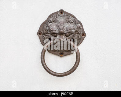 dragon head door knocker, isolated on white background, with clipping path Stock Photo