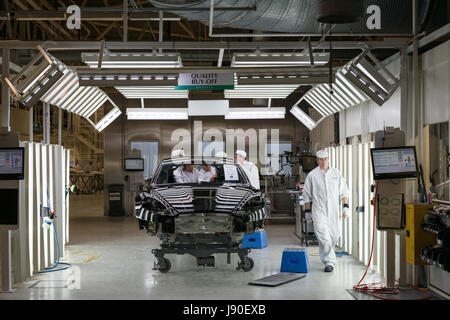 Gaydon, UK - 08/10/2016. A car body sits in a spray painting bay. Customers can choose from a wide range of colours and finishes. Stock Photo