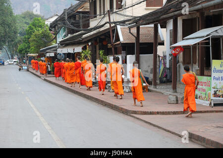 Monks collecting alms in Luang Prabang Laos Stock Photo