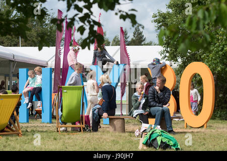 Hay Festival, Wales UK, Tuesday 30 May 2017  Children playing in the sunshine on the giant 'Hay 30' sign  on the 6th day of the 2017 Hay Festival, in the small Welsh town of Hay on Wye in rural Powys.  Now in its 30th year, the literature festival draws some of the best writers , academics and commentators from across the globe, and  tens of thousand of visitors a day to what was described by former US president Bill Clinton as 'the woodstock of the mind'    Photo credit © Keith Morris / Alamy Live News Stock Photo