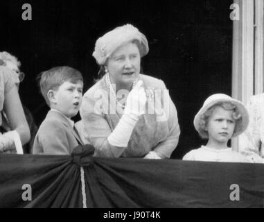 May 05, 1956 - Prince Charles and Princess Anne look on their mother to come riding up the all. Photo shows the Queen Mother talks to the Royal Children on the balcony of Buckingham Palace this morning as they wait for the Queen to come riding down the all to take the salute outside Buckingham Palace. (Credit Image: © Keystone Press Agency/Keystone USA via ZUMAPRESS.com) Stock Photo