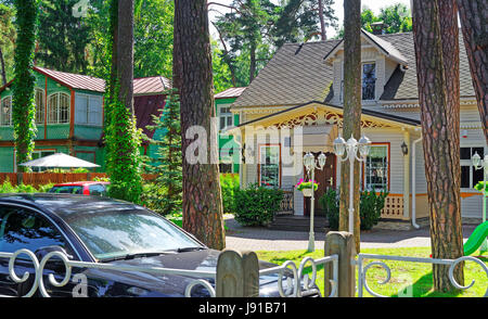 Car at the traditional wooden house in Jurmala, Latvia recreational resort Stock Photo