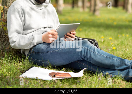 Handsome bearded man use tablet PC Stock Photo