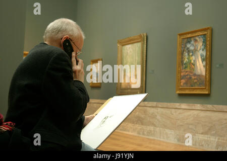 Man sketching in an Art Museum, based on classic works of art exposed in the gallery Stock Photo