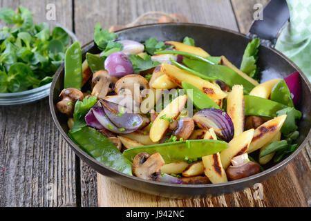 Bavarian fried finger-shaped potato dumplings with vegetable Stock Photo