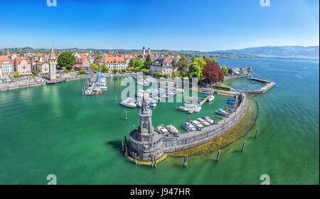 Harbor on Lake Constance with statue of lion at the entrance in Lindau, Bavaria, Germany Stock Photo
