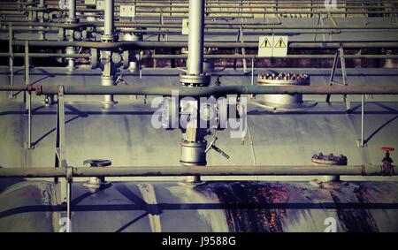 tanks in the storage of flammable materials with safety valves on top with vintage effect Stock Photo