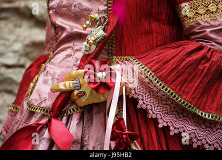 Women's hands in gloves and medieval dress. Stock Photo