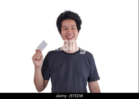 Adult Asian man smiling while holding blank credit card isolated on white background Stock Photo