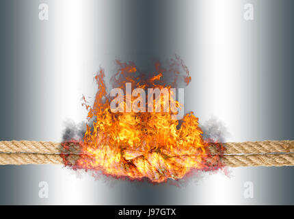 Strong rope with a knot, bursted into flames, isolated against the silver colored background Stock Photo