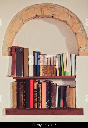 Old books on shelf Stock Photo