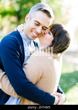 Woman kissing man Stock Photo