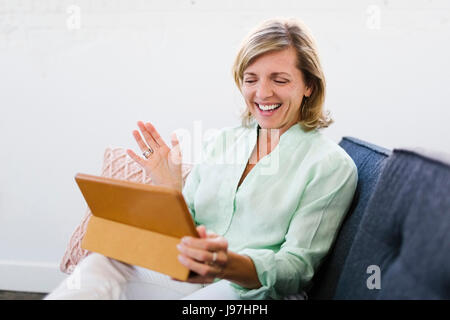 Mature woman using tablet Stock Photo