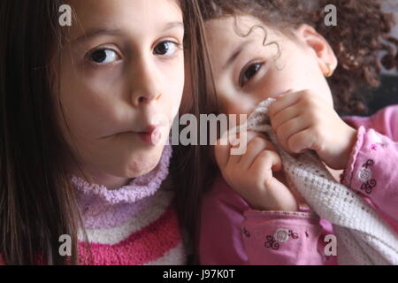 Portrait of two little sisters making funny faces Stock Photo