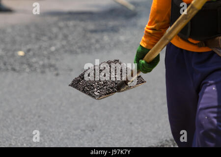 Worker working in roadwork site Stock Photo