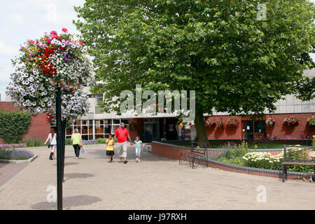 The library and pedestrianised area in the centre of Market Drayton, Shropshire, with the annual floral displays Stock Photo