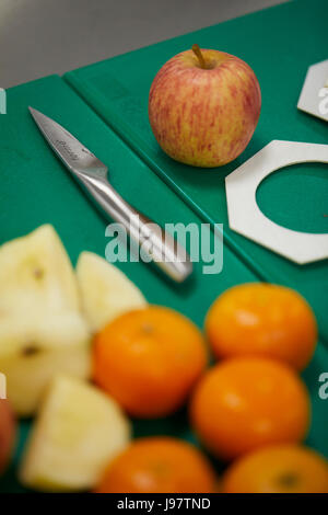 checking the quality of fruit before in supermarket quality control Stock Photo
