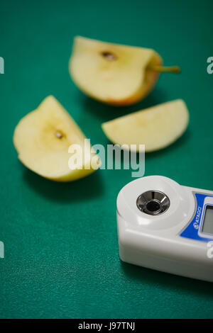 checking the quality of fruit before in supermarket quality control juicy testing. Stock Photo