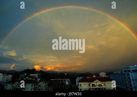 Beautiful evening rainbow over Kota Kinabalu, Sabah, Malaysia. Stock Photo