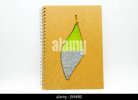 Environment concept : book with zip and water and grass on white background Stock Photo